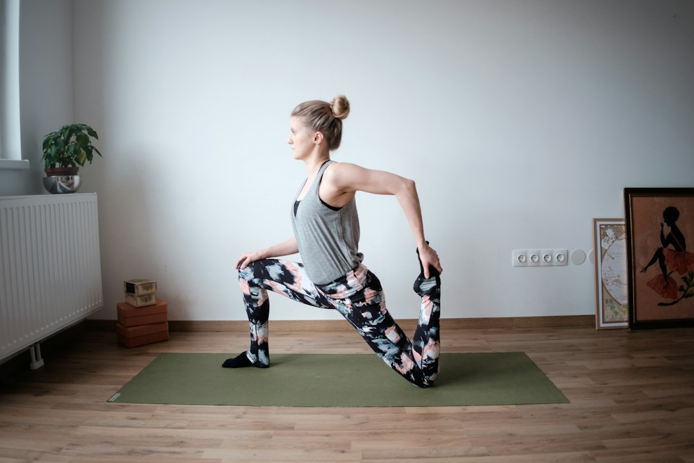 Stretching on a mat at home in the morning